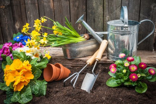 Expert gardeners working on a lush Limehouse garden
